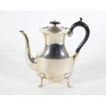 A late Victorian silver coffee pot, with everted wavey border and waisted oval body with query
