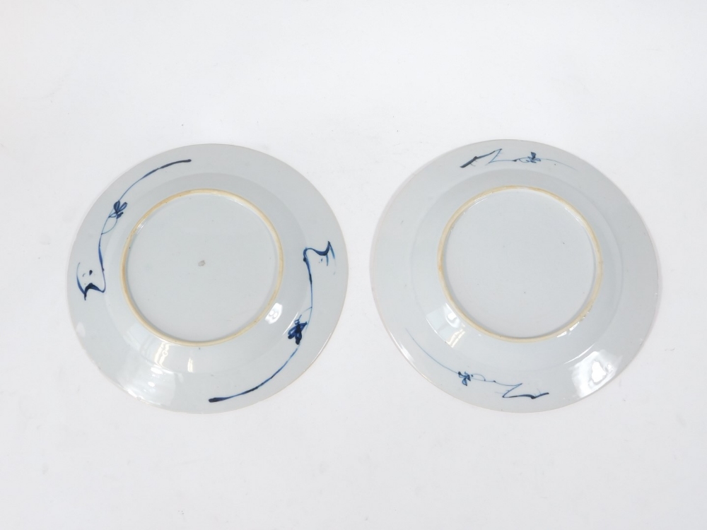 A pair of mid 18thC Chinese blue and white plates, decorated with flowers and foliage, 23cm - Image 2 of 2