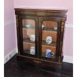 A late 19thC ebonised and brass inlaid side cabinet, with gilt metal mounts, the plain top above a