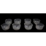 A set of eight early 19thC glass rinser bowls, with slice cut decoration and star cut bases, 12cm