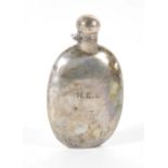 A George V silver hip flask, of plain oval design with bayonet cap, initialled NEL, Sheffield