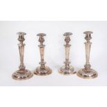 Two pairs of Victorian silver plated baluster candlesticks, with urn shaped holders and tapered