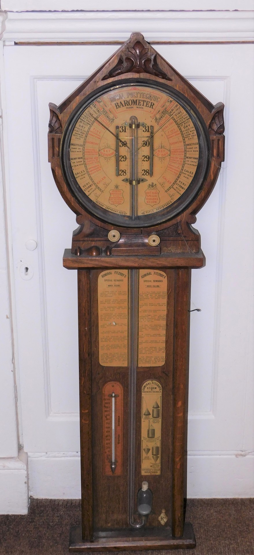 A late 19thC Royal Polytechnic Admiral Fitzroy barometer, in a shaped case, the circular dial with