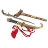 A Malayan Kris, with hardwood and silver coloured metal, scabbard, elaborately shaped blade and