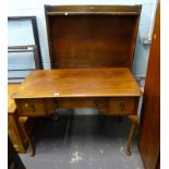 A mahogany dressing table, with a moulded edge, on cabriole legs, and an open bookcase.