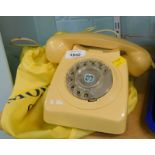 An ivory coloured BT telephone, numbered 746F/DFM75/1.