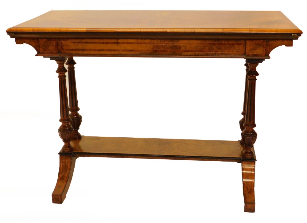 A Victorian exhibition quality figured walnut card table, the rectangular top with a moulded edge