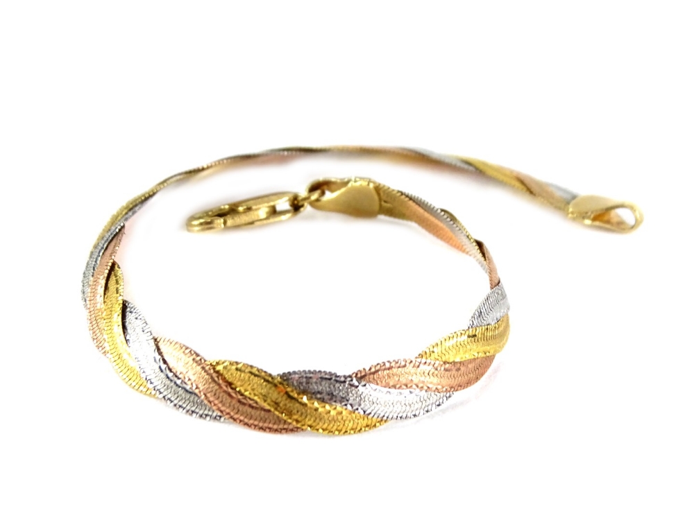 A white and yellow metal bracelet, stamped 375, 4.9g.