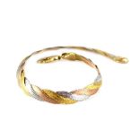 A white and yellow metal bracelet, stamped 375, 4.9g.