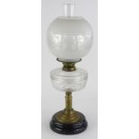 A Victorian brass oil lamp, with a frosted shade and cut clear glass reservoir, a brass