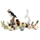 A collection of ceramic animals, to include a seated Sylvac dog, a Russian weasel or ferret, Beswick