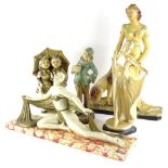 A collection of Art Deco and early 20thC plaster figures, to include a dancing figure on simulated