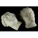 Two similar plaster wall masks, each cast in neoclassical style in the form of gentlemen, one