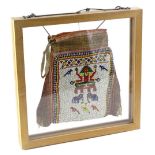 A South American Indian type beadwork purse, decorated with figures, exotic animals, birds etc.,