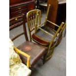 A pair of gilt marquee or conference type gilt dining chairs and an Edwardian dining chair. (3)