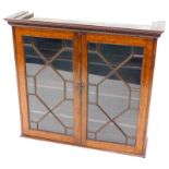 A 19thC mahogany bookcase, the top with a moulded dental cornice, and two astragal glazed doors,