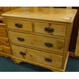 A small pine chest of two short and two long drawers, on bracket feet, 70cm wide.