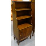 A mahogany waterfall bookcase, with single door on square tapering legs, 51cm wide.