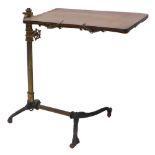 A Victorian cast iron and gilt metal bed table or reading stand, with a mahogany adjustable top, the