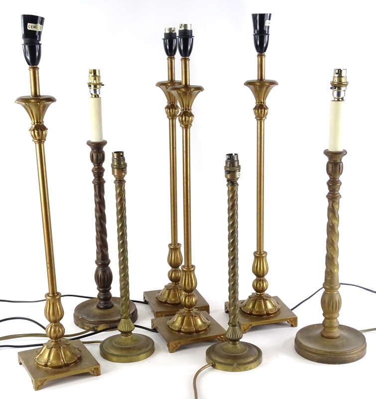 A quantity of brass and other column shaped table lamps, etc.