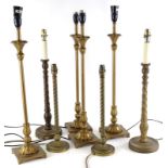A quantity of brass and other column shaped table lamps, etc.