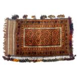 A Turkoman camel bag or Juval, decorated with geometric motives in shades of brown, with tags,