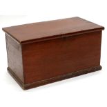 A Victorian brown stained pine blanket box, the hinged lid enclosing a vacant interior on plinth