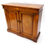 A Victorian walnut side cabinet, the top with a moulded edge above a marquetry frieze of scrolls and