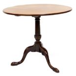 A George III mahogany tilt top table, the circular top on a turned column and tripod base, with