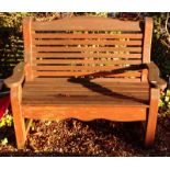 A stained wooden slatted garden bench.