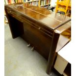 An Eavestaff mahogany mini piano, with chrome fittings, etc., 181cm wide.
