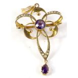 A 9ct gold amethyst pendant, with central stone and various circles and ovals, embellished with seed