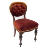 A Victorian mahogany balloon back side chair, with an oval back, upholstered in buttoned dark pink
