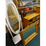 A collection of furniture, to include a pine wall mirror with shelf, a pine rack containing baskets,