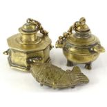 An octagonal Middle Eastern inkwell, with lid attached to a chain, another similar circular example,