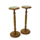 A pair of beech urn or plant stands, each with a turned top, a spirally fluted column and a