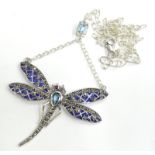 A plique-a-jour dragonfly necklace, set with marcasite and rubies, with blue and purple colouring,
