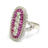 An Art Deco elongated ruby and diamond dress ring, set with old cut and round brilliant cut