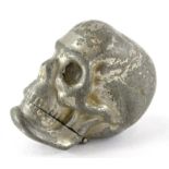 A novelty plated base metal skull shaped Vesta vase, 5cm high.