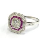 A ruby and diamond Art Deco style target ring, with central round brilliant cut diamond,