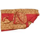 A gold and red damask bed covering, a duvet cover and 2 pillow cases.