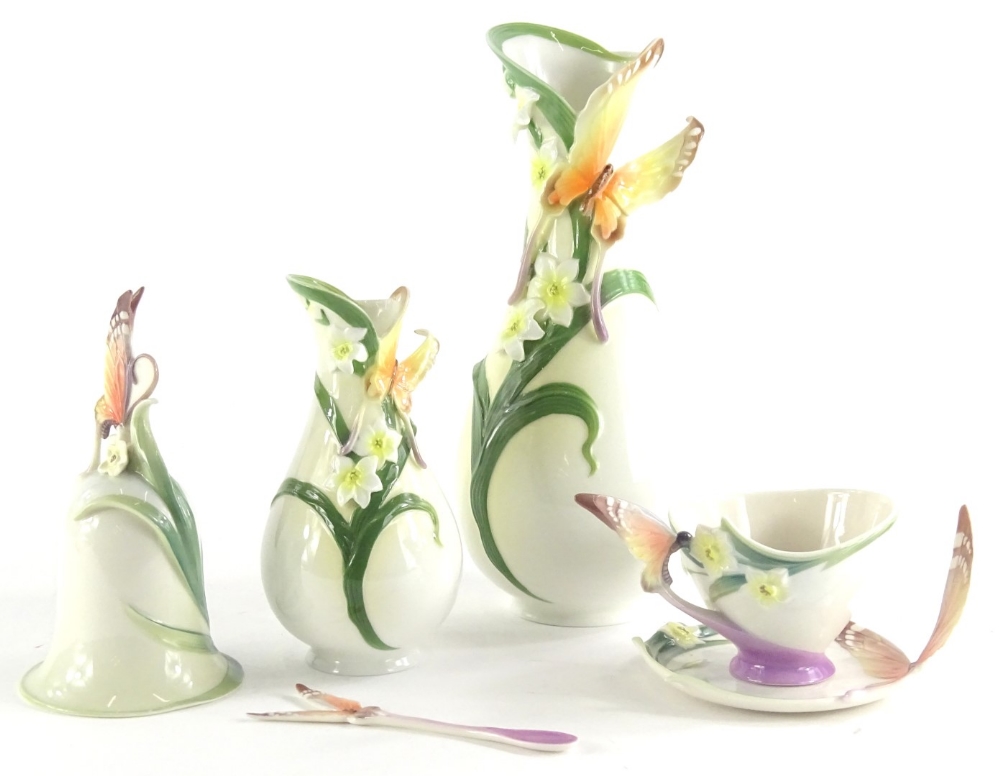 A collection of Franz and Graff porcelain, to include two vases, a bell and a cup, saucer and spoon,