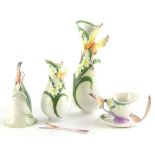 A collection of Franz and Graff porcelain, to include two vases, a bell and a cup, saucer and spoon,