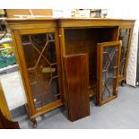 An early 20thC walnut astragal bookcase, with a pair of glazed doors, flanking another pair of