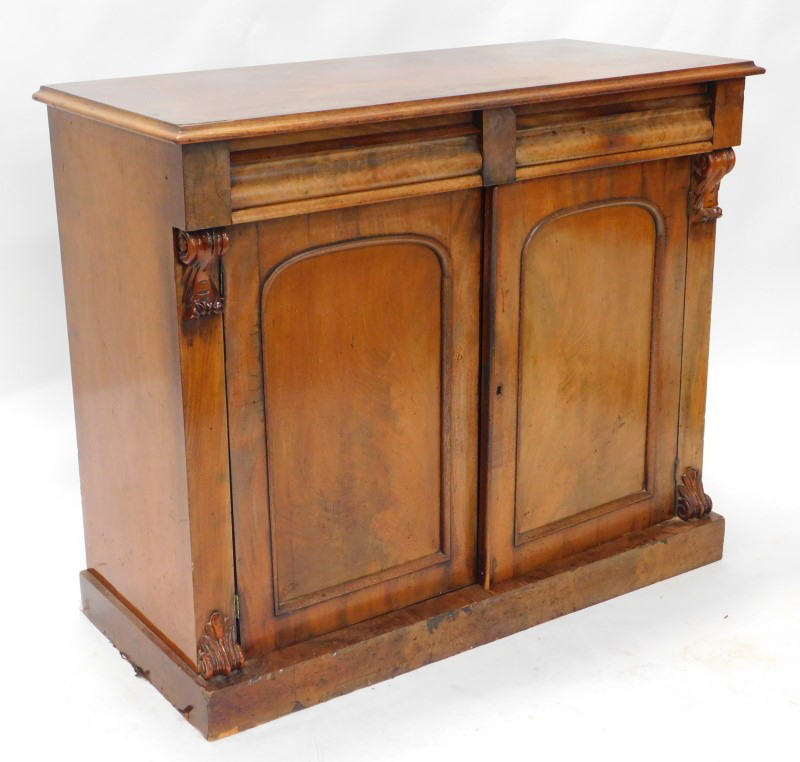 A Victorian mahogany side cabinet, the figured top with a moulded edge above two frieze drawers