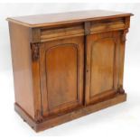 A Victorian mahogany side cabinet, the figured top with a moulded edge above two frieze drawers