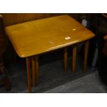 A nest of three 1960s/70s light oak Ercol style tables, the largest 65cm wide.