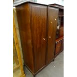 A Stag Minstrel mahogany two door wardrobe.
