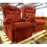 A pair of electric reclining armchairs, upholstered in deep red fabric.