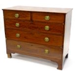 An early 19thC mahogany and boxwood strung chest of drawers, with plain top above two short and